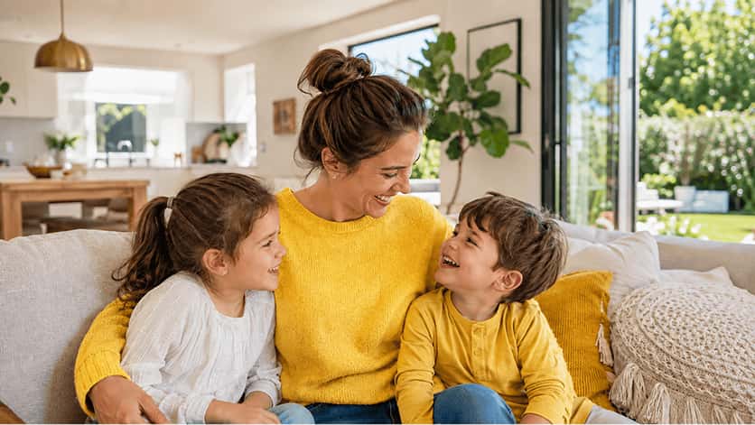 A parent enjoying time at home with her children