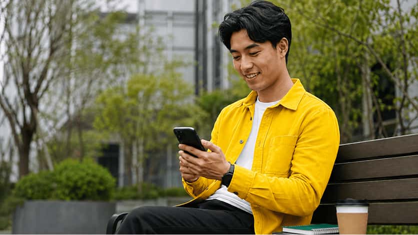 A young professional building his business from a park
